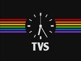 Clock with rainbow coloured horizontal stripes and TVS logo underneath