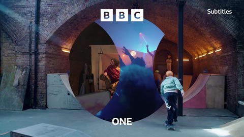 Skateboarders having fun, with a circular lens revealing the space is also used for a rave and for a life drawing class at different times of the day. (24K)