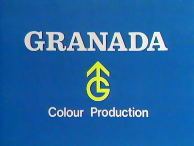 Yellow G arrow symbol on a light blue background with the Granada name above it (20K)