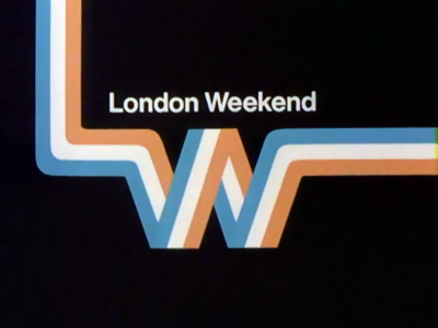 A stripe of light blue, white and orange on a black background with London Weekend caption (18K)