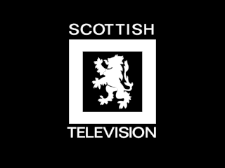 Scottish Television black and white ident - a rampant white lion enclosed by a thick rectangular border on a black background