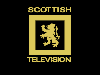 Scottish Television colour ident - a rampant yellow lion enclosed by a thick rectangular border on a black background