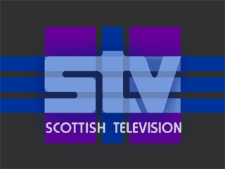 Light blue STV logo formed from blue and purple tartan pattern