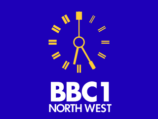 Yellow clock with white BBC 1 NORTH WEST lettering underneath